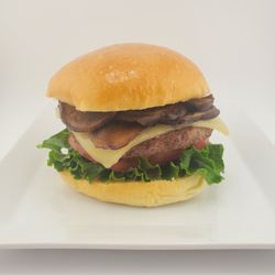 MUSHROOM SWISS BURGER 1/3 lb. beef with lettuce, onion, tomato, swiss cheese , portobello or shitake mushrooms on a brioche bun