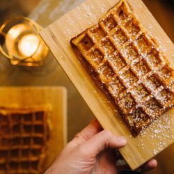 Awake - Fresh homemade waffles with powder sugar and cinnamon