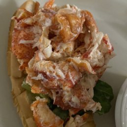 a lobster sandwich on a white plate a lobster sandwich on a white plate