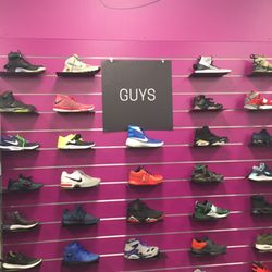 Plato's Closet - A guys shoe display wall.