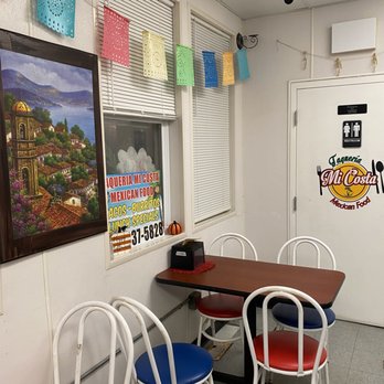 Taquria Mi Costa - tables and chairs in a restaurant - Mexican Near Me - Indianapolis, Indiana Taquria Mi Costa - tables and chairs in a restaurant - Mexican Near Me - Indianapolis, Indiana