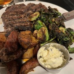 Jack's Restaurant - 12 ounce ribeye with garlic butter, fried Brussel sprouts and roasted red potatoes.