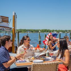 View - Embrace summer days with a must-have: outdoor seating by the water's edge!