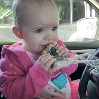 Hula Grill - Precious little one, who refused to give up the Spam Musubi - Food Trucks Near Me - Talent, Oregon