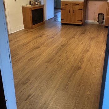 Artwood Floors - This is a vinyl floor they installed in kitchen.  They chose a color that would match with the hardwood floors in other room. - Flooring Near Me - Fairfield, Connecticut