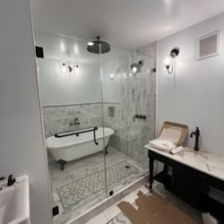Premium Windows & Glass - After installing the two panels shower enclosure