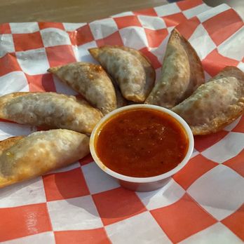 The Cue Club - a plate of empanadas and a bowl of sauce - Sports Bars Near Me - Annandale, Virginia The Cue Club - a plate of empanadas and a bowl of sauce - Sports Bars Near Me - Annandale, Virginia