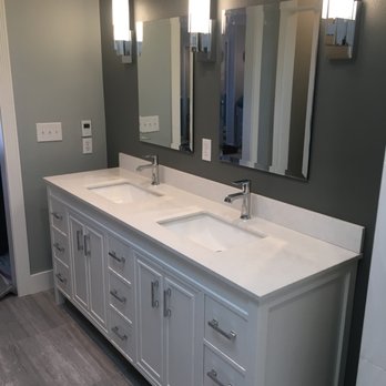 Wellspring Remodeling - a bathroom with double sinks - Painters Near Me Wellspring Remodeling - a bathroom with double sinks - Painters Near Me