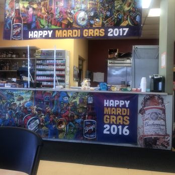 Qwik-Chek - a happy mardi gras display - Delis Near Me - Metairie, Louisiana