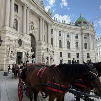 Hofburg - traditional Fiaker horse-drawn carriages waiting in front of the Michaelertor (St. Michael's Gate) of the Hofburg Imperial Palace - Venues & Event Spaces Near Me - Vienna, 9