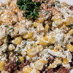Maya Cocina Mexicana - Esquiles Street corn with chorizo and served with homemade chips