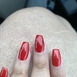 Nails & Spa - Middle nail is crooked and there is acrylic all around my cuticles