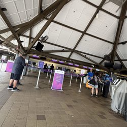 Asking agent for assistance for earlier flight