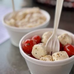 New York Corner Deli - Tomato, basil, mozzarella salad and potato salad in the back
