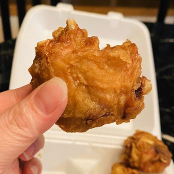 Tea House - a hand holding a piece of fried chicken - Chinese Near Me - Lakewood, Washington Tea House - a hand holding a piece of fried chicken - Chinese Near Me - Lakewood, Washington