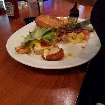 Blue's Egg + Bakery - 3 egg sandwhich on a hoagie bun almost all gone. - Breakfast & Brunch Near Me - Milwaukee, Wisconsin Blue's Egg + Bakery - 3 egg sandwhich on a hoagie bun almost all gone. - Breakfast & Brunch Near Me - Milwaukee, Wisconsin