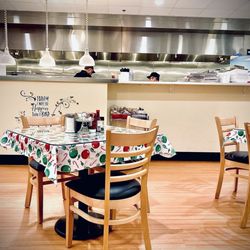 The Cup Cafe - Dining area with a view of the kitchen