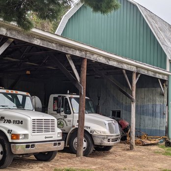 S Imperial Services - two trucks parked in front of a barn - Lawn Services Near Me - Saginaw, Michigan