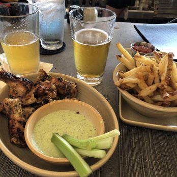 Monkeypod Kitchen - Happy Hour wings and fries - New American Near Me - Lahaina, Hawaii