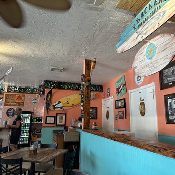 Crackers Island Grille - a surfboard hanging from the ceiling - American Near Me - Cape Canaveral, Florida Crackers Island Grille - a surfboard hanging from the ceiling - American Near Me - Cape Canaveral, Florida
