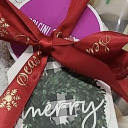 a gift wrapped in a red ribbon