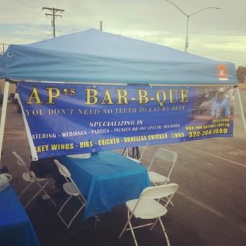 AP's BBQ - a blue tent with a blue table cloth - Street Vendors Near Me - Gardena, California
