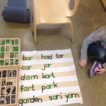 Cleveland Montessori - A student uses the phonogram alphabet to explore spelling and language rules. - Preschools Near Me - Cleveland, Ohio Cleveland Montessori - A student uses the phonogram alphabet to explore spelling and language rules. - Preschools Near Me - Cleveland, Ohio