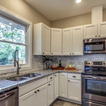 TC Construction - a clean kitchen with stainless steel appliances - General Contractors Near Me TC Construction - a clean kitchen with stainless steel appliances - General Contractors Near Me