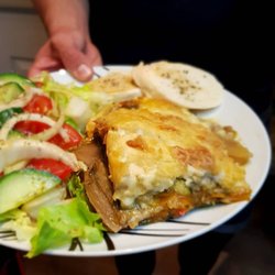 Cafe AINA - AINA mousakas is made with soya mince and vegetables. The bechamel and cheese are also vegan so everyone can enjoy it.