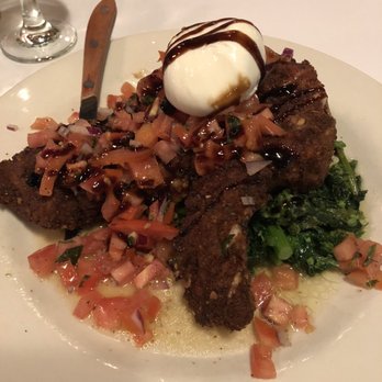 Guy Anthony's - Double cut pork chop Milanese topped with bruschetta - Italian Near Me - North Merrick, New York Guy Anthony's - Double cut pork chop Milanese topped with bruschetta - Italian Near Me - North Merrick, New York
