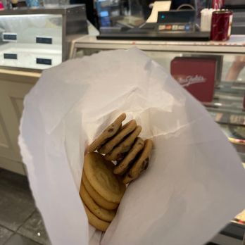 Mrs. Fields Meadows Mall - a hand holding a bag of cookies - Desserts Near Me - Las Vegas, Nevada