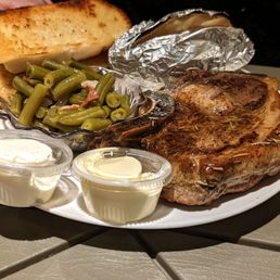 Pork Chop, Baked potatoes and beans. $11. Pork Chop, Baked potatoes and beans. $11.