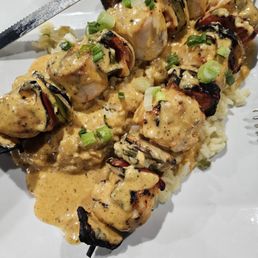 Chicken Kabobs on rice.