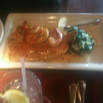 Pappadeaux Seafood Kitchen - Sea bass with sauteed spinach - Seafood Near Me - Houston, Texas Pappadeaux Seafood Kitchen - Sea bass with sauteed spinach - Seafood Near Me - Houston, Texas