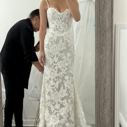 VIP Couture Bridal Alterations - Hemmed, sized down, trimmed the train, added an internal corset, and inner skirt!!!