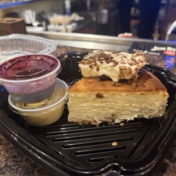Charleston's - ADAMS CHEESECAKE with fresh blueberry could and lemon cello sauce - American Near Me - Indianapolis, Indiana
