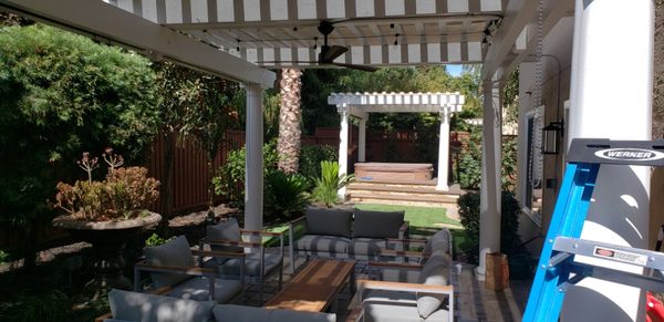 Outdoor Lighting - This outdoor lighting project was completed on a beautiful patio in Pleasanton California. The home owner wanted lighting as well as a ceiling fan to keep cool during warm summer nights on the patio. We also added new String lighting around the entire yard redwood fence. Outdoor Lighting - This outdoor lighting project was completed on a beautiful patio in Pleasanton California. The home owner wanted lighting as well as a ceiling fan to keep cool during warm summer nights on the patio. We also added new String lighting around the entire yard redwood fence.