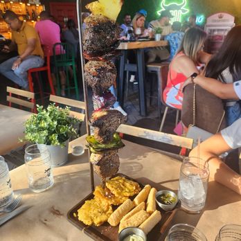 Mu Restaurant And Grill - La Espetada with tostones and fried yuca - Latin American Near Me - Kissimmee, Florida Mu Restaurant And Grill - La Espetada with tostones and fried yuca - Latin American Near Me - Kissimmee, Florida