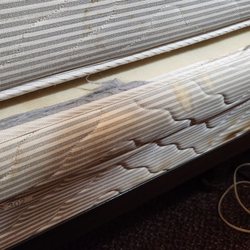 Stained mattress with no fitted sheet.