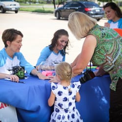 Advanced Smiles - Patient Appreciation Event - Complete with white tents, catered food and refreshments, raffle items, a rock-climbing wall and dunk tank!