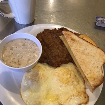 Just Breakfast on Silverbell - Chicken-fried steak, gravy on the side, over-medium eggs and sourdough. Coffee is excellent. - Breakfast & Brunch Near Me - Tucson, Arizona