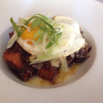 Red Feather Kitchen - Breakfast Poutine: short rib gravy, hash brown, cheddar, sunny side up egg, scallions - New American Near Me - Cincinnati, Ohio Red Feather Kitchen - Breakfast Poutine: short rib gravy, hash brown, cheddar, sunny side up egg, scallions - New American Near Me - Cincinnati, Ohio