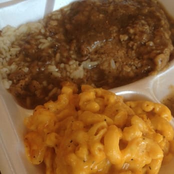 Big Daddy's Kitchen - Smothered pork chops served with rice and macaroni and cheese. - Soul Food Near Me - Atlanta, Georgia
