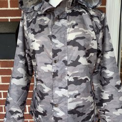 Champagne Taste - Waterproof rain coat with hood.  If you left home without yours, stop by Champagne Taste for rain coats and reversible rain ponchos.