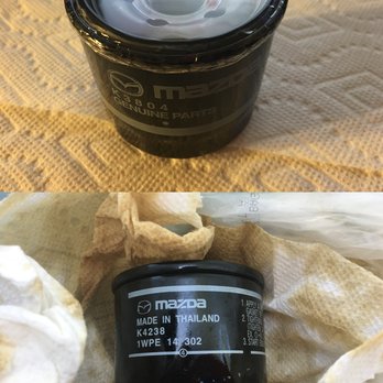Putnam Mazda - Top: Original Mazda Oil Filter Made in Japan Bottom: Cheap Replacement Oil Filter Installed by Putnam - Car Dealers Near Me - Burlingame, California