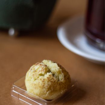 Tokara - a muffin in a plastic container on a table - Desserts Near Me - Seattle, Washington