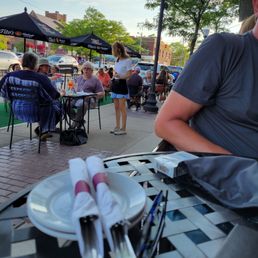 Outdoor dining on a hot night . Outdoor dining on a hot night .