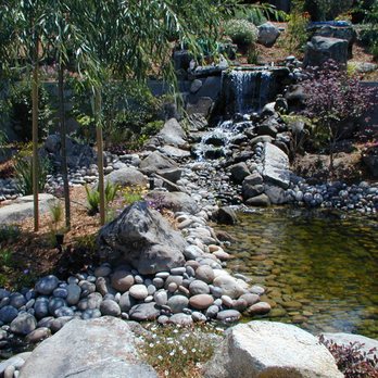 Brian Milligan Construction - Waterfall, Streams and (2) Ponds with Low Voltage Lighting, Mulch, Plants and Trees - Landscaping Near Me Brian Milligan Construction - Waterfall, Streams and (2) Ponds with Low Voltage Lighting, Mulch, Plants and Trees - Landscaping Near Me