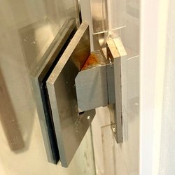 GP Company Glass Shower Doors - Rust on defective hinge