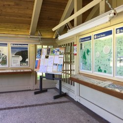 Manning Park Visitor Centre - Outside foyer of building - some of the wall displays, bulletin board.